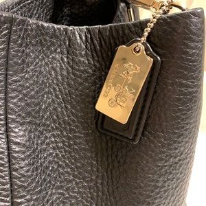 Black Pebble leather coach shoulder bag. Gold hardware with logo tag.